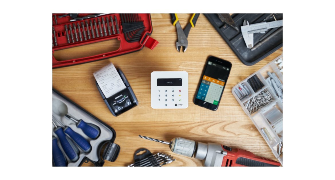 smartphone and cash registers surrounded by tools