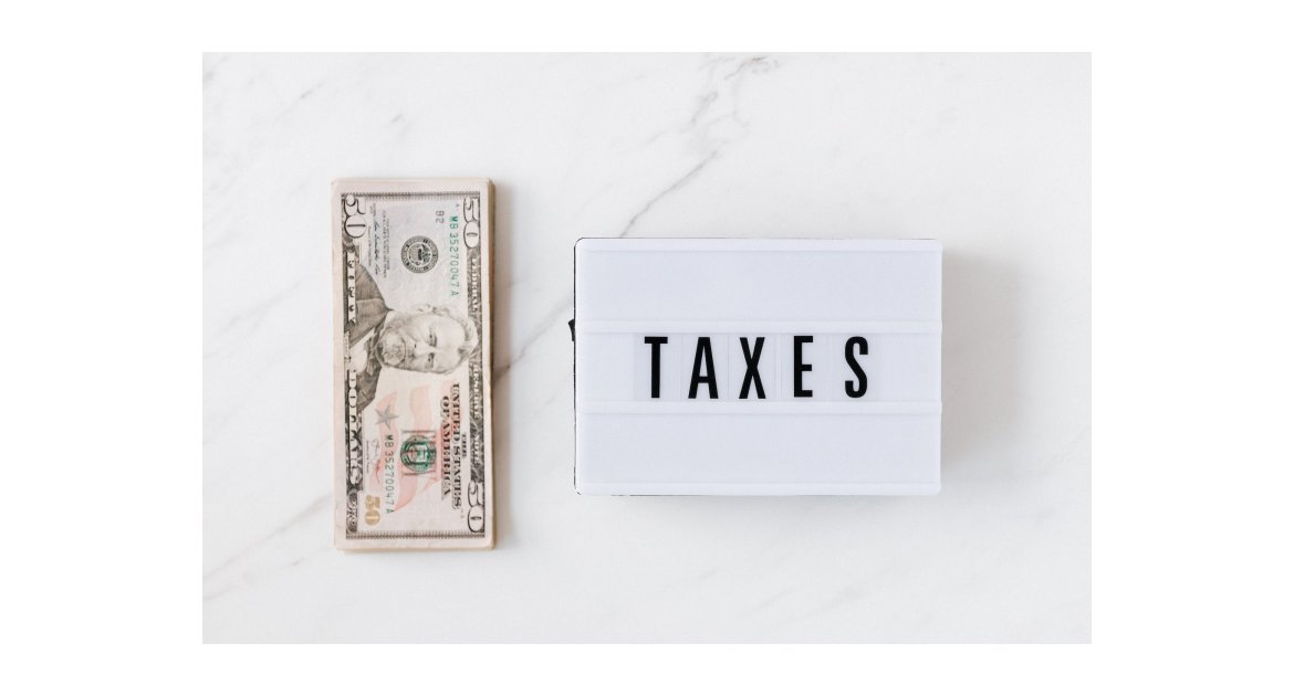 american dollar bills and vintage light box with inscription