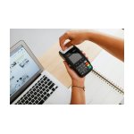 a person holding payment terminal