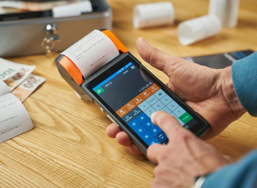 photo of a person printing a receipt