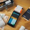 cash and payment terminal on table