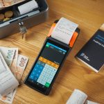cash and payment terminal on table