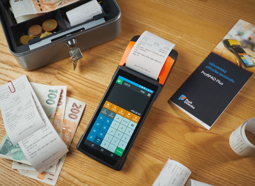 cash and payment terminal on table